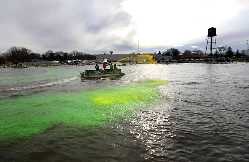 Dye is sprayed into the Fox River to dye the river green during the McHenry’s ShamROCKS the Fox Festival on Saturday, March 14, 2026, in McHenry.
