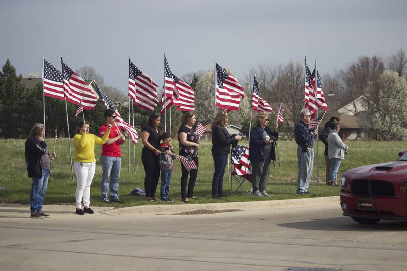 Attendees at the funeral procession on Friday, April 18, 2025, outside Tezak Funeral Home in Joliet, for for U.S. Army Staff Sgt. Jose Dueñez Jr. He was one of four soldiers who died March 31, 2025 when their armored vehicle sunk in a bog during a training mission in Lithuania.