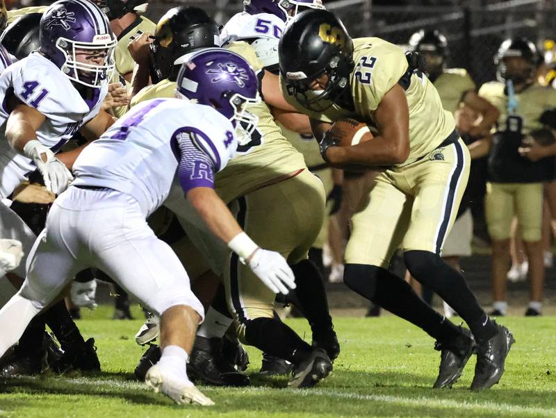 Sycamore's Dylan Curtis tries to run through Rochelle's Gavin Neale during their game Friday, Sept. 19, 2025, at Sycamore High School.