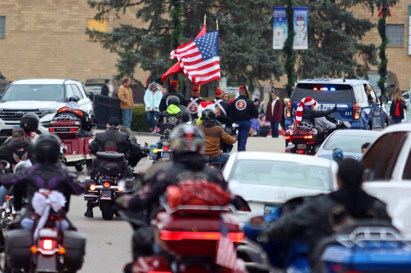Motorcyclists cruise during the Toys for Tots Parade on Sunday, Nov. 24, 2024, in downtown McHenry.
