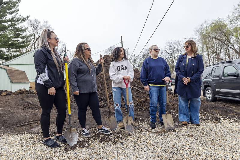 Rachel Deskins (right), Public Relations Coordinator for Dixon Habitat for Humanity, speaks to new home owner Nichole Richardt (second from left) Saturday, April 19, 2025, during the groundbreaking ceremony for the newest build.