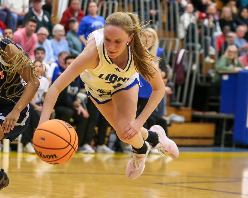 Lyon's Tess Bernson (11) dives for a loose ball during their Class 4A Lyons Sectional semifinal basketball game between Lyons vs Young. Feb 25, 2025 in La Grange.