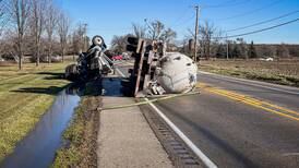 Semitrailer truck rolls over, leaks wastewater in four-vehicle crash in Woodstock