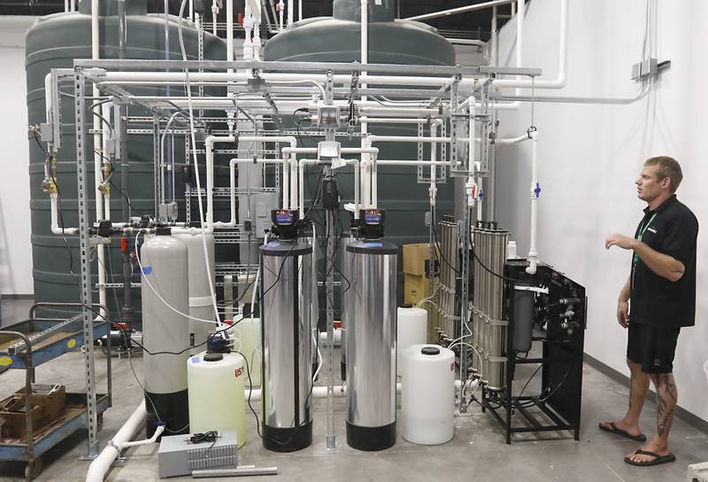 Oregonix Farms COO Owen Papworth talks about the water system during a tour of Oregonix Farms' new craft grow facility in Huntley on Friday, July 14, 2023.
