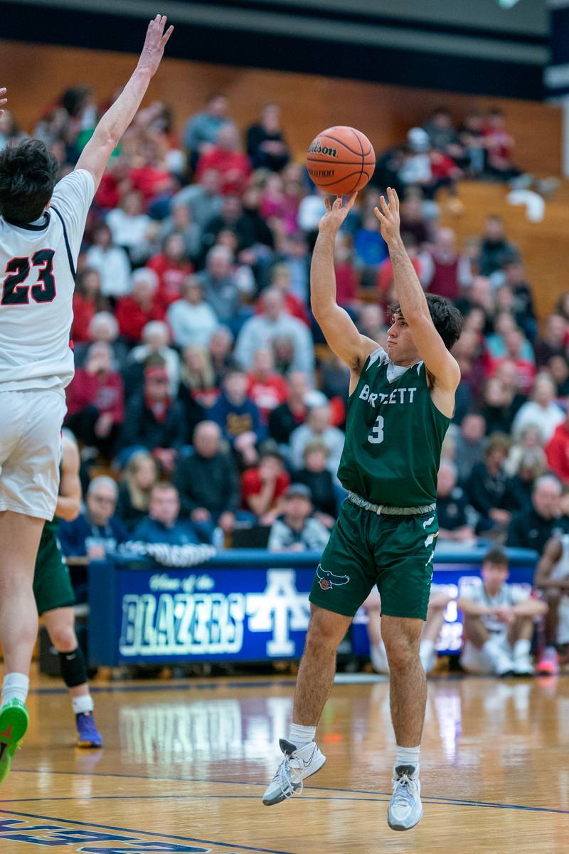 Bartlett's Keegan Kunzer (3) shoots the ball against Benet’s Nikola Abusara (23) during the 4A Addison Trail Regional final at Addison Trail High School in Addison on Friday, Feb 24, 2023.