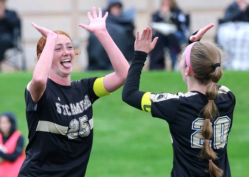 Sycamore's Isabelle Segreti (left) celebrates after scoring a goal with teammate Cortni Kruizenga during their game against Kaneland Wednesday, April 29, 2026, at Sycamore High School.