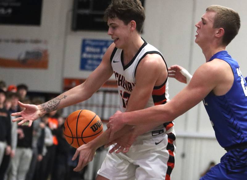 Burlington Central’s Jacob Johnson, right, tussles with  McHenry’s Caleb Jett in varsity boys basketball on Tuesday, Feb. 4, 2025, at  McHenry High School  in McHenry.