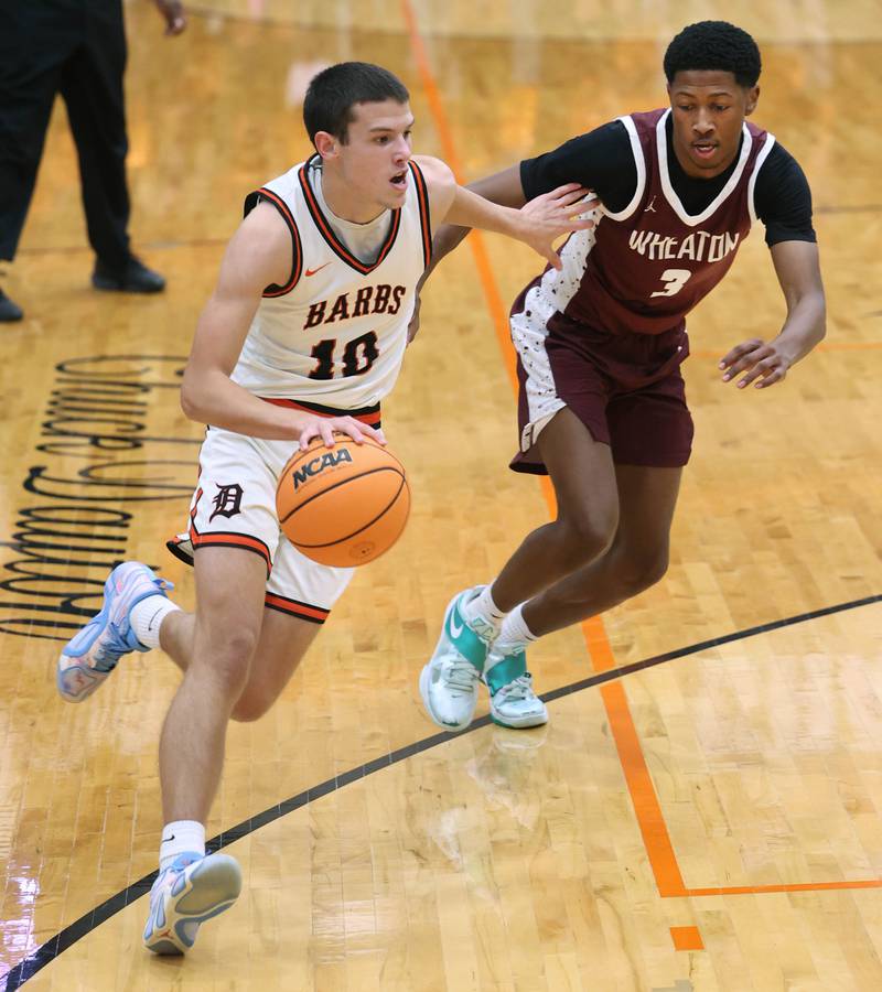 DeKalb's Jack Rosenow goes baseline against Wheaton Academy's Donell Ausley Jr. during their game Wednesday, Jan. 14, 2026, at DeKalb High School.