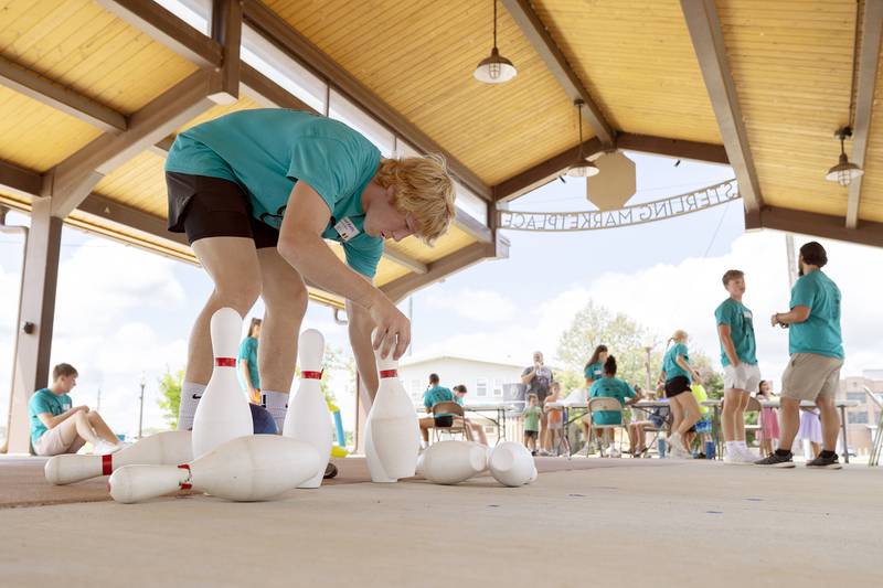 Building Lasting Impressions that Never Die (BLIND) leader Daniel Kelly of Newman sets up pins for a day of fun Friday, Aug. 2, 2024, during Sterling’s Hot Dog Day.