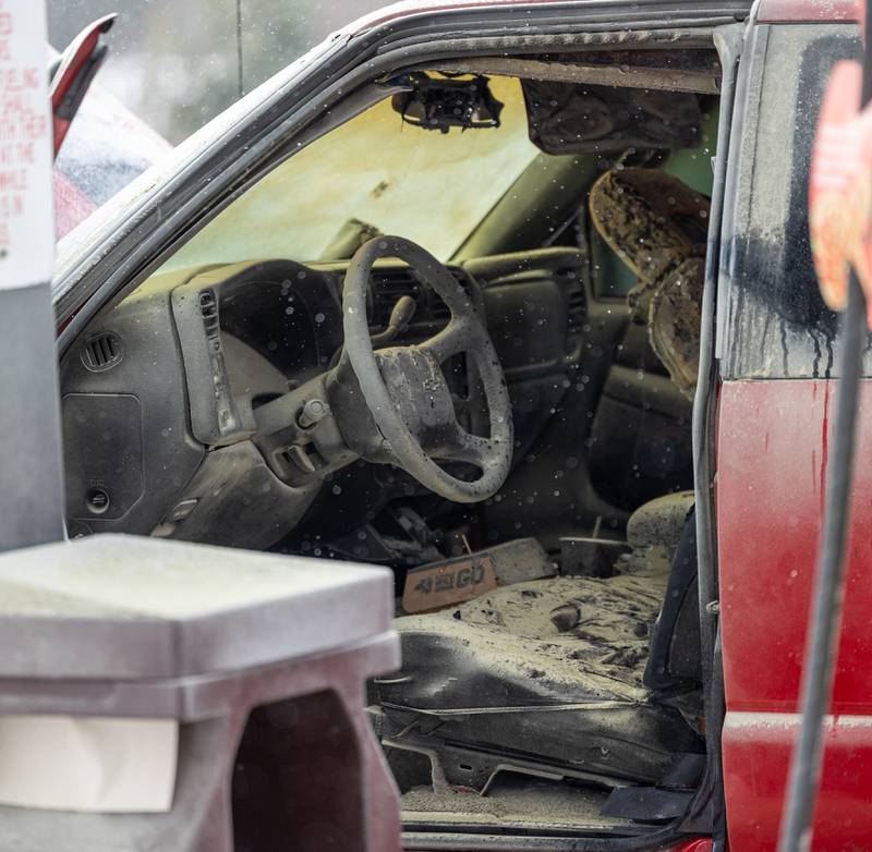 Charred remains of vehicle interior sit at scene of internal electrical fire of vehicle near gas pump on Tuesday, December 30, 2025 at Casey's on 1100 Shooting Park Road in Peru. The fire was extinguished by 15 year old driver Jesus Gonzalez of Streator.