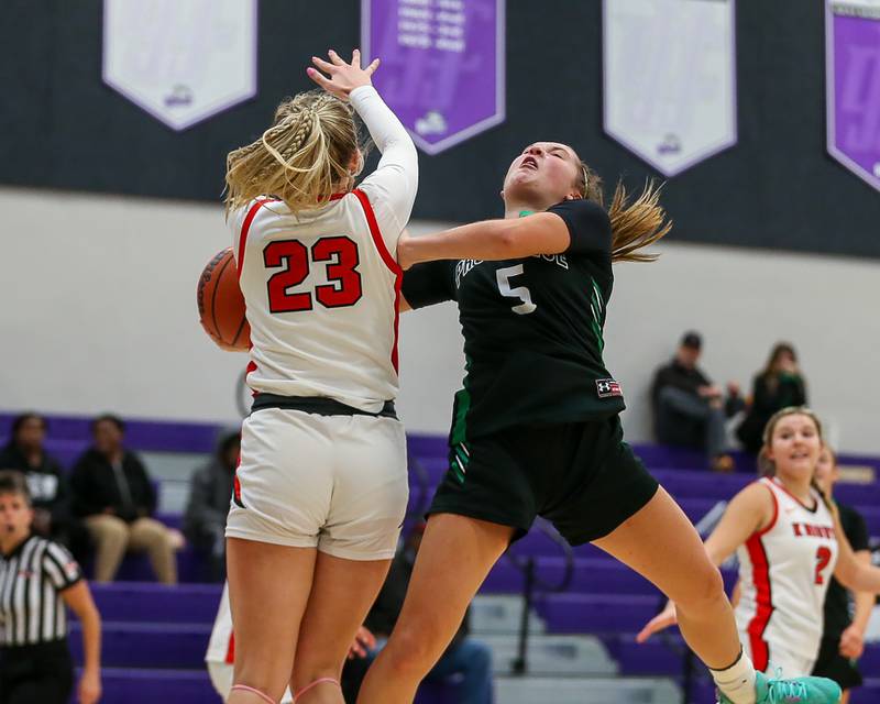 Lincoln Way Central's Brooke Baechtold (23) defends a shot attempt by Providence's Sydney Spencer (5) in the WJOL Tournament Championship game. Nov 18, 2023.