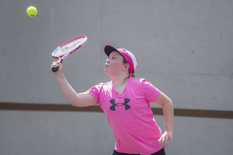 Brynnley Adams returns a shot while playing in the 11 and under girls singles at the Emma Hubbs tennis classic Thursday, July 26, 2022.