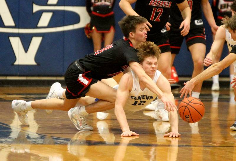 Batavia’s Jack Ambrose (left) and Geneva’s Thomas Diamond (right) go after a loose ball during a game at Geneva on Friday, Feb. 3, 2023.