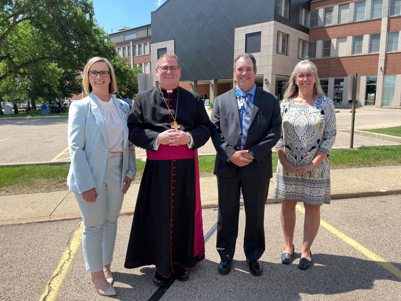 Jackie Kernan, president, the Most Reverend Bishop Louis Tylka, Scott Hartman, vice president of Support Services, and Deb May-Rickard, chief nursing officer, pose for a photo following the blessing and dedication of OSF HealthCare Saint Clare Medical Center on July 1, 2021.