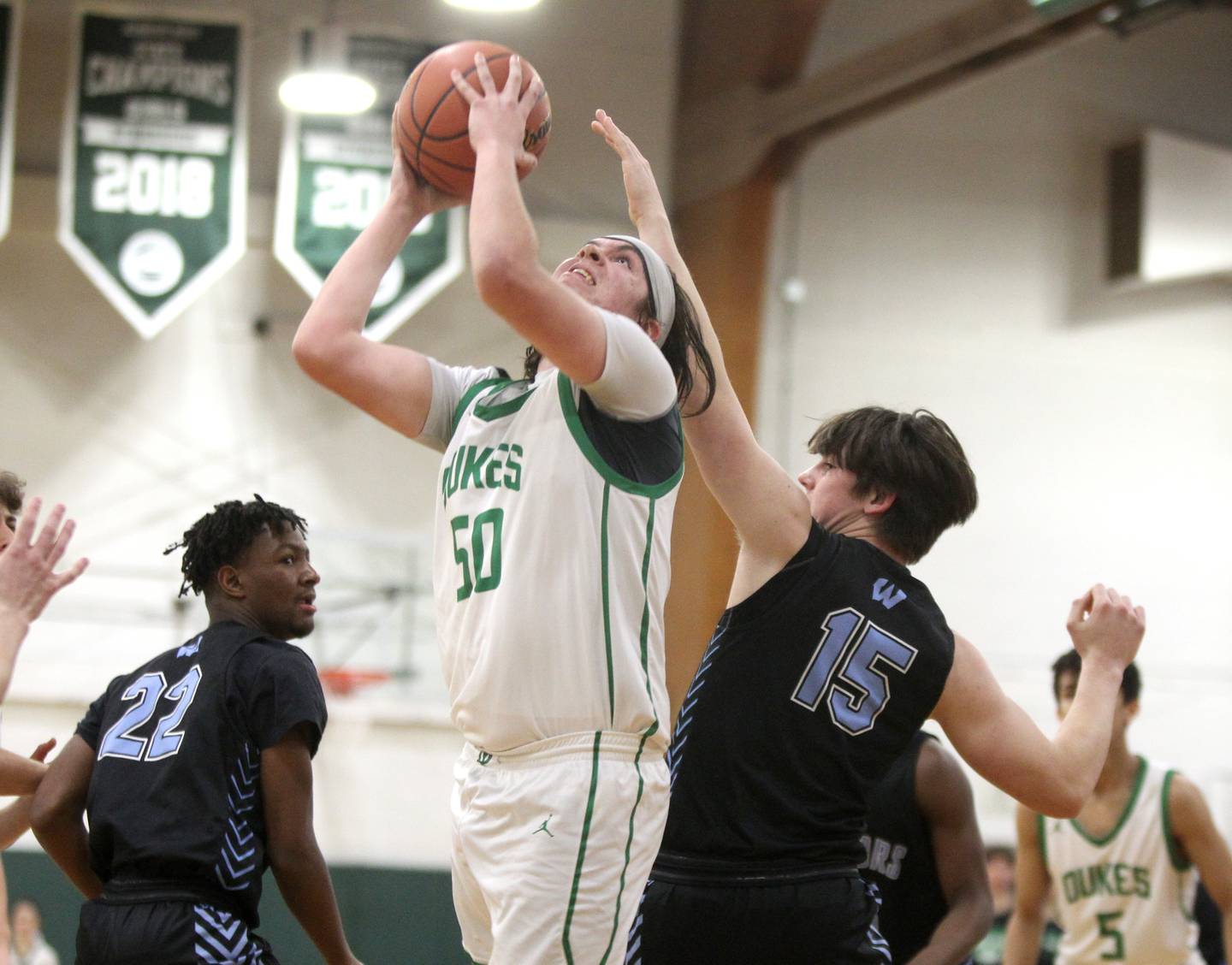 York’s Adam Hardek attempts a shot after rebounding the ball during a Class 4A Glenbard West Regional semifinal against Willowbrook in Glen Ellyn on Wednesday, Feb. 23, 2022.