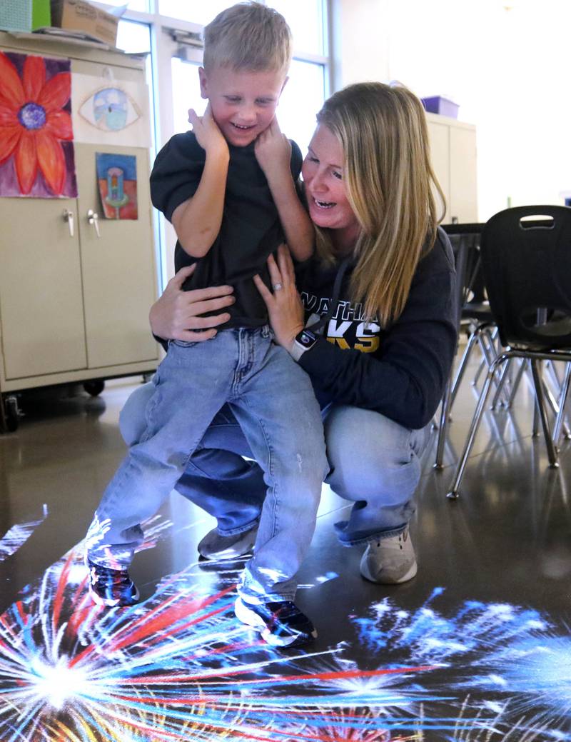 Jack Sanderson, 6, and his mom Libby, from Kirkland, have some fun with an interactive projected image Wednesday, Nov. 6, 2024, during a grand opening of the Kishwaukee Special Recreation Association’s Sensory Room at the Sycamore Park District Community Center.