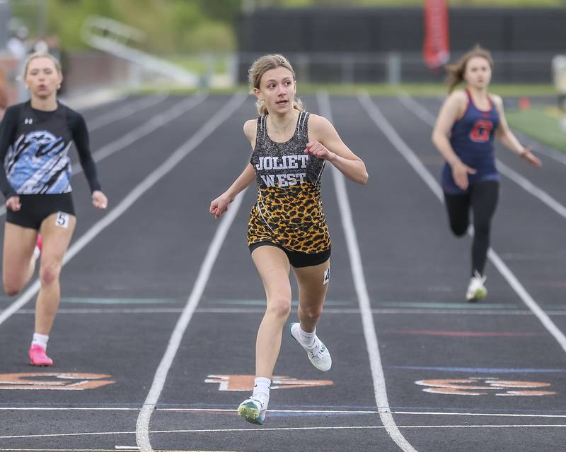 Joliet West's Cassidy Malloy wins her 400m heat during Southwest Prairie Conference Girls Track and Field Meet Wednesday, May 7, 2025 in Minooka.