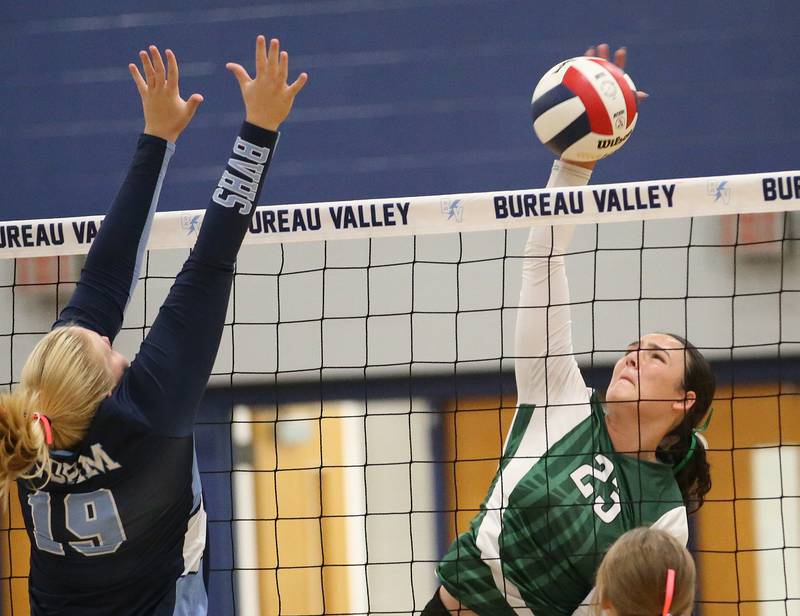 St. Bede's Ali Bosnich spikes the ball past Bureau Valley's Emma Stull on Tuesday, Sept. 5, 2023 at Bureau Valley High School.