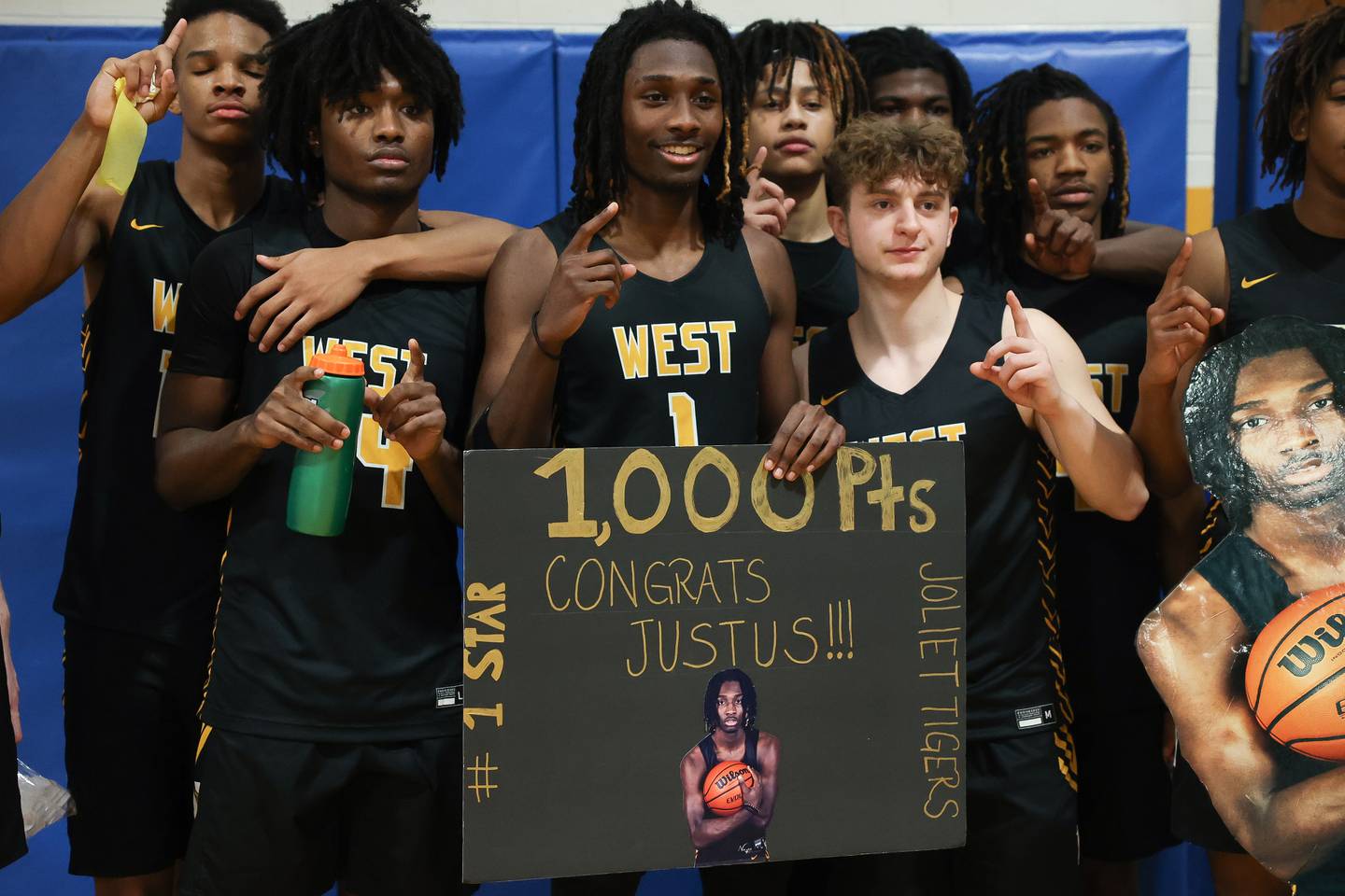 Joliet West’s Justus McNair celebrates his 1,000th high school career point after the game against Joliet Central on Saturday, Jan. 27th, 2024 in Joliet.