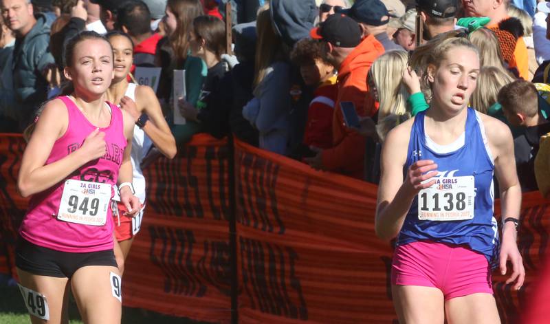 Aurora Rosary's Vivian Wyller and Lake Villa Lake's Paige-Elicia Caruth compete in the Class 2A State Cross Country race on Saturday, Nov. 4, 2023 at Detweiller Park in Peoria.