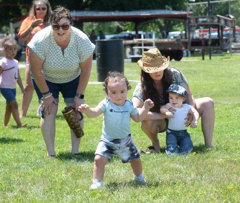 Zayden Haehnel, 14 months, runs to the finish line in the Hooppole Fun Day's Diaper Dash as fellow competitor Cyrus Countryman, 15 months, waits to start on Saturday, June 28, 2025 in Hooppole.