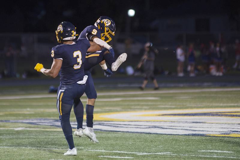 Sterling’s Antonio Tablante (left) and AJ Kested celebrate a score against Lakes Friday, Aug. 26, 2022.