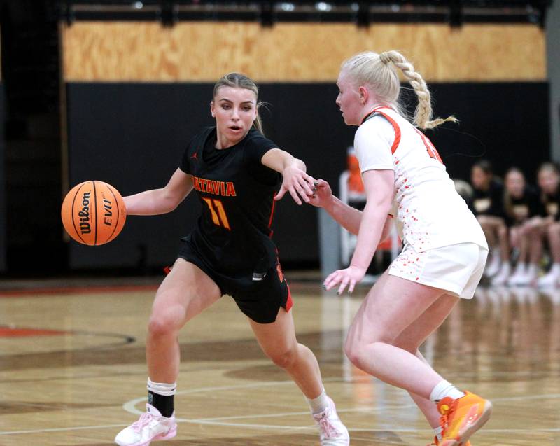 Batavia’s Kaidyn King tries to get the ball past St. Charles East’s Addie Schilb during a game on Wednesday, Jan. 8, 2025 in St. Charles.