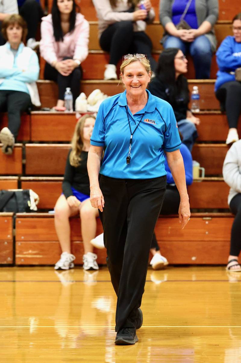 Patti Blumhorst smiles between sets in Tuesday's match at Prouty Gym between Princeton and Mendota.