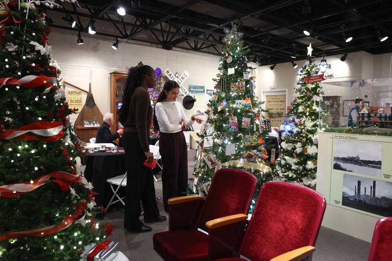 Attendees admire trees at the Kankakee County Museum during the 47th annual Gallery of Trees kickoff event on Wednesday, Dec. 3, 2025.