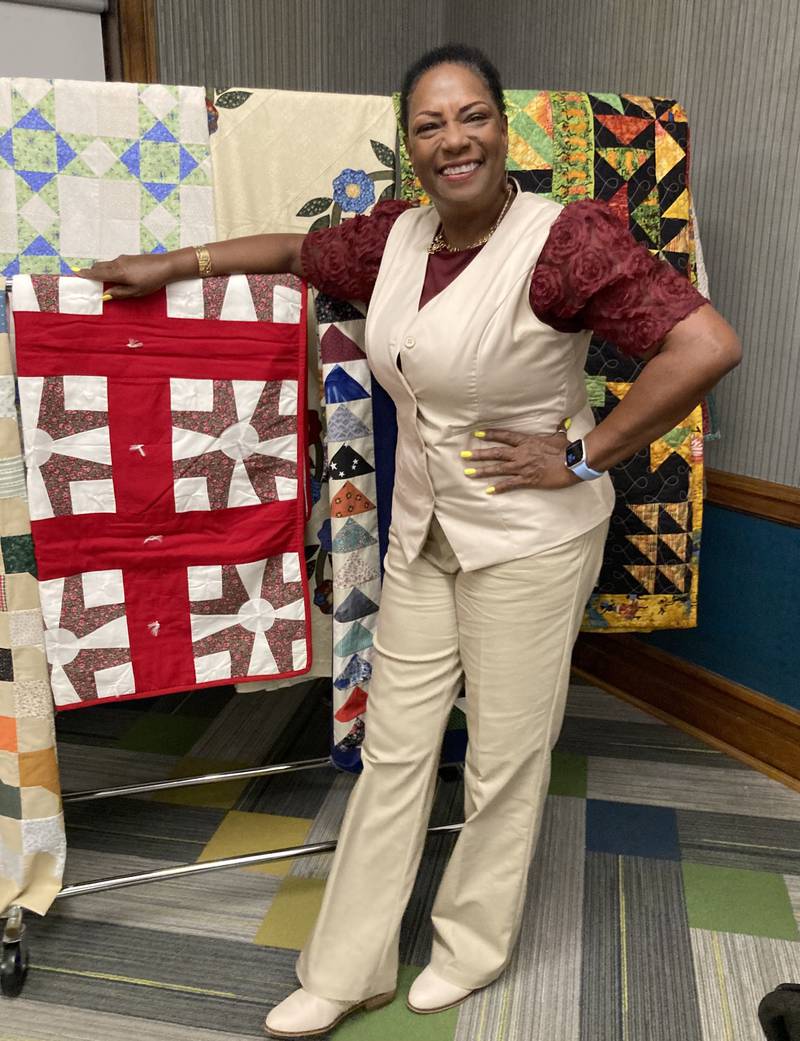 Connie Martin stands next to her replica Underground Railroad quilts Tuesday, June 26, 2024, after her presentation at the Streator Public Library.