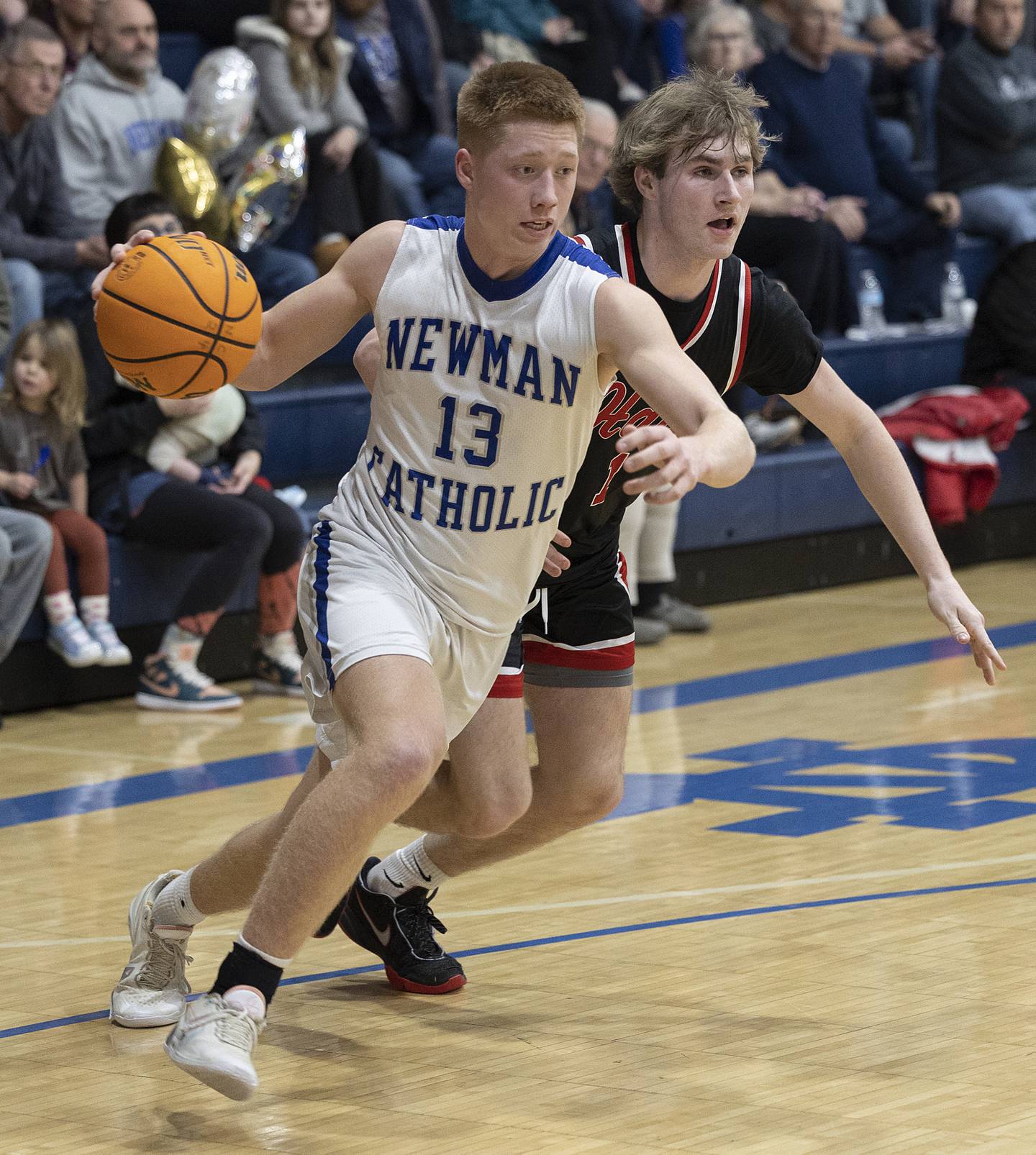 Newman’s George Jungerman drives to the hoop against Hall Friday, Jan. 17, 2025 at Newman High School.