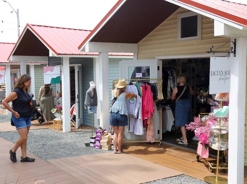 Shoppers check out Boo Boo Days sales at the Boardwalk Shops in Batavia on Sunday, July 13, 2025.