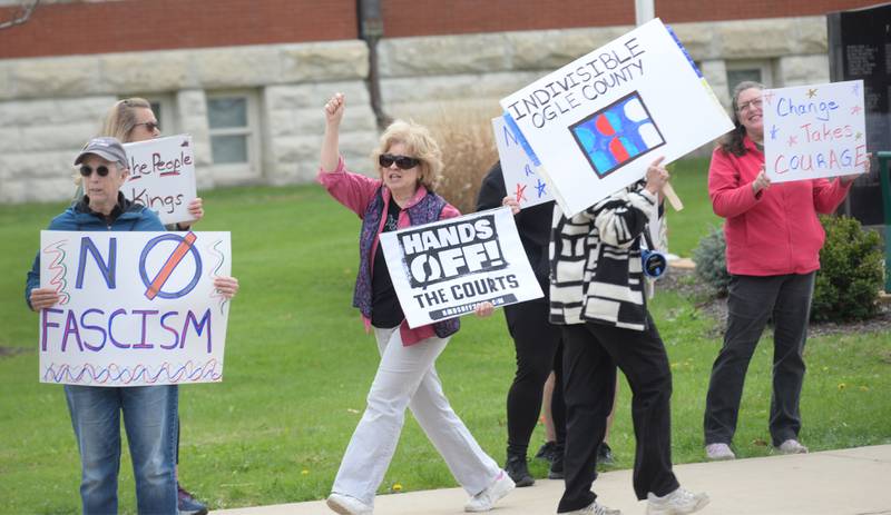 Approximately 250 people attended a Hands Off rally on Saturday, April 19, 2025 around the historic Ogle County Courthouse in Oregon. Participants carried signs critical of  the Trump administration. Saturday's rally followed an April 5 rally held at the same location.