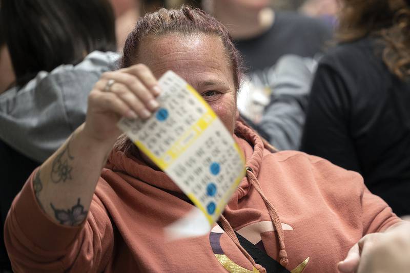 Jackie Hall of Rock Falls shows off her winning card Thursday, Nov. 21, 2024. Hall won a basket from Bath and Body Works.