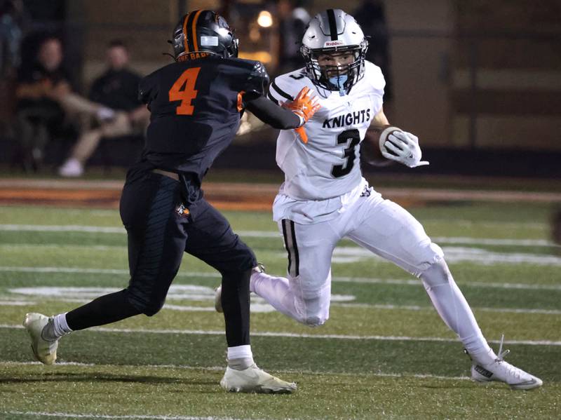 Kaneland's Luke Gadomski tries to get by DeKalb's kirk johnson on a kick return during their game Friday, Sept. 12, 2025, at DeKalb High School.
