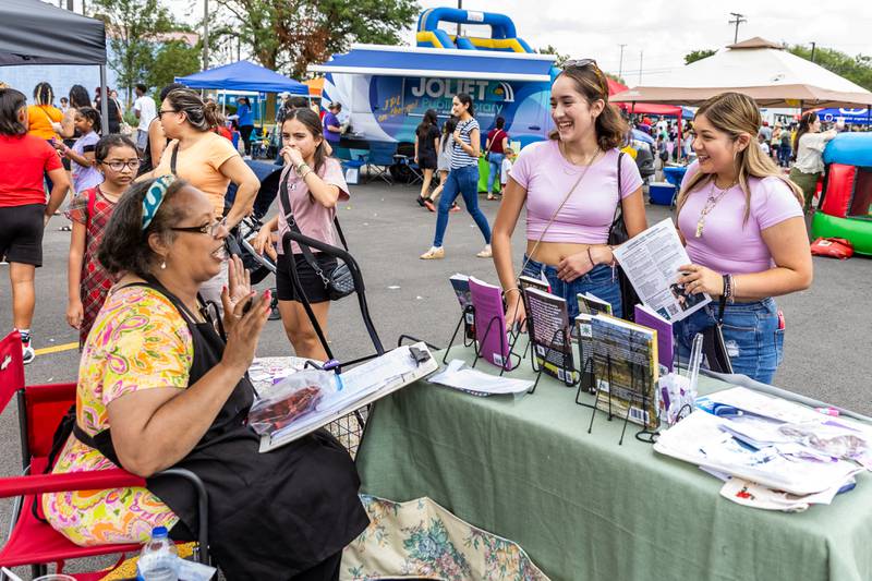 Author Veda Gavin chats with Gizelle Garcia and Jasmine Martinez at Kidz Fest in Joliet on Aug. 3, 2024.