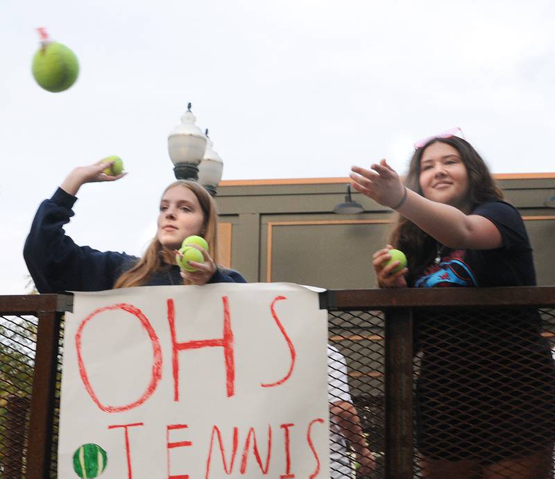 The The Ottawa Township High School Tennis team tossed out tennis ball to those along the parade route Tuesday evening during the school’s Homecoming Parade.