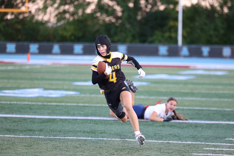 Joliet West's Ella Featherston runs the ball during the Tigers' 13-7 loss to Oswego on Tuesday, Oct. 7, 2025.