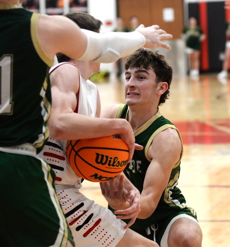 Peru St. Bede's Gino Ferrari (4) ties up the ball against Forreston on Wednesday, Feb. 26, 2025 at the 1A Amboy Regional at Amboy High School.