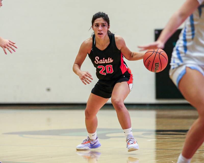 St Charles East's Alexis Maridis (20) looks over the defense at the York Thanksgiving Tournament. Nov 13, 2023.