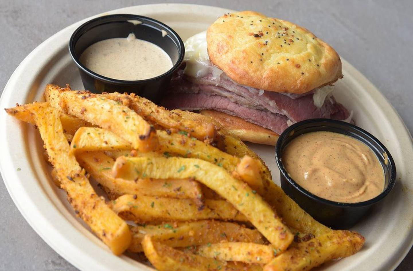 AJ's Hangout recently opened in South Elgin, offering fresh made, low carb foods that contain no sugar, wheat, gluten or soy. The menu features nine sliders, including the Reuben, all of which are made on "Power Bread" made of almond flour, cheese, egg and spices. Also pictured are their garlic Parmesan "freedom fries," made of rutabaga.