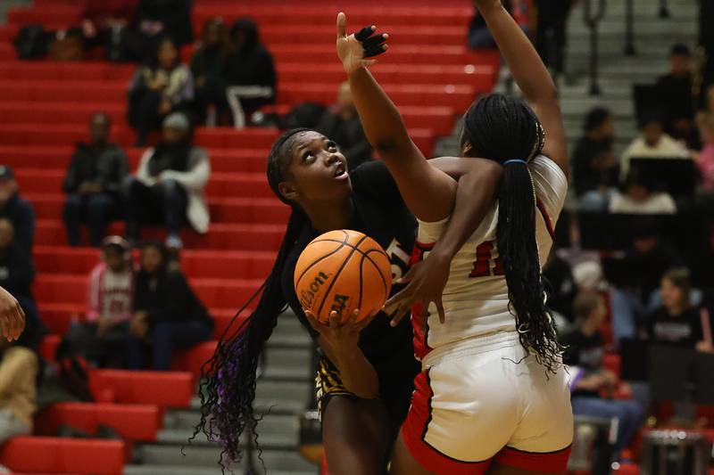 Joliet West’s Temprence Jackson gets tangled up with the defender taking a shot aagainst Bolingbrook on Thursday, Jan 23, 2025 in Bolingbrook.