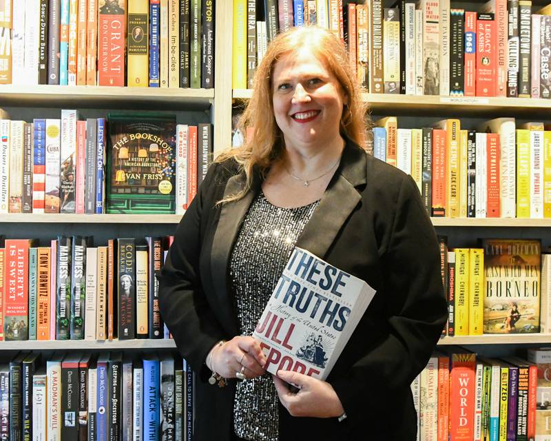 Jen Hall poses for a photo on Friday Oct. 3, 2025, at the Harvey’s Tales bookstore in Geneva.