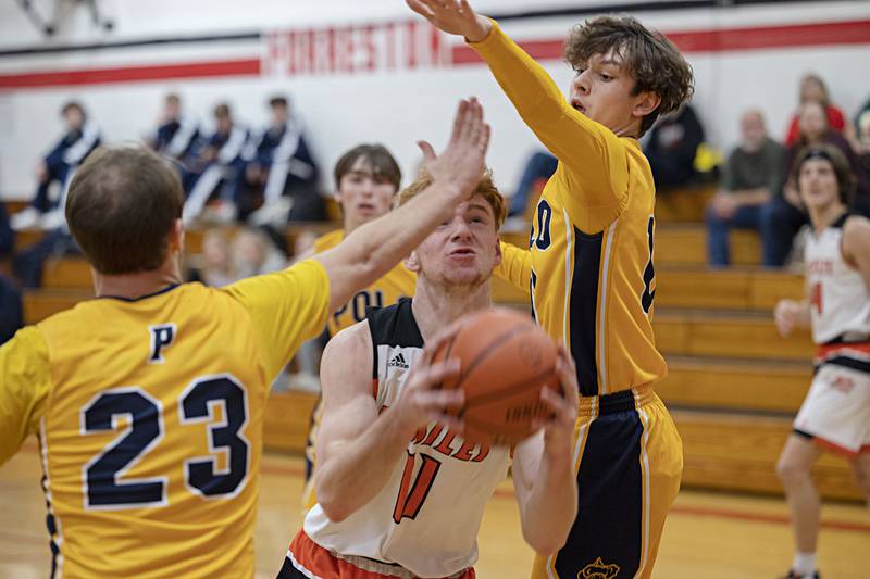 Milledgeville’s Connor Nye drives the lane Monday, Dec. 19, 2022 against Polo in the Forreston Holiday Tournament.