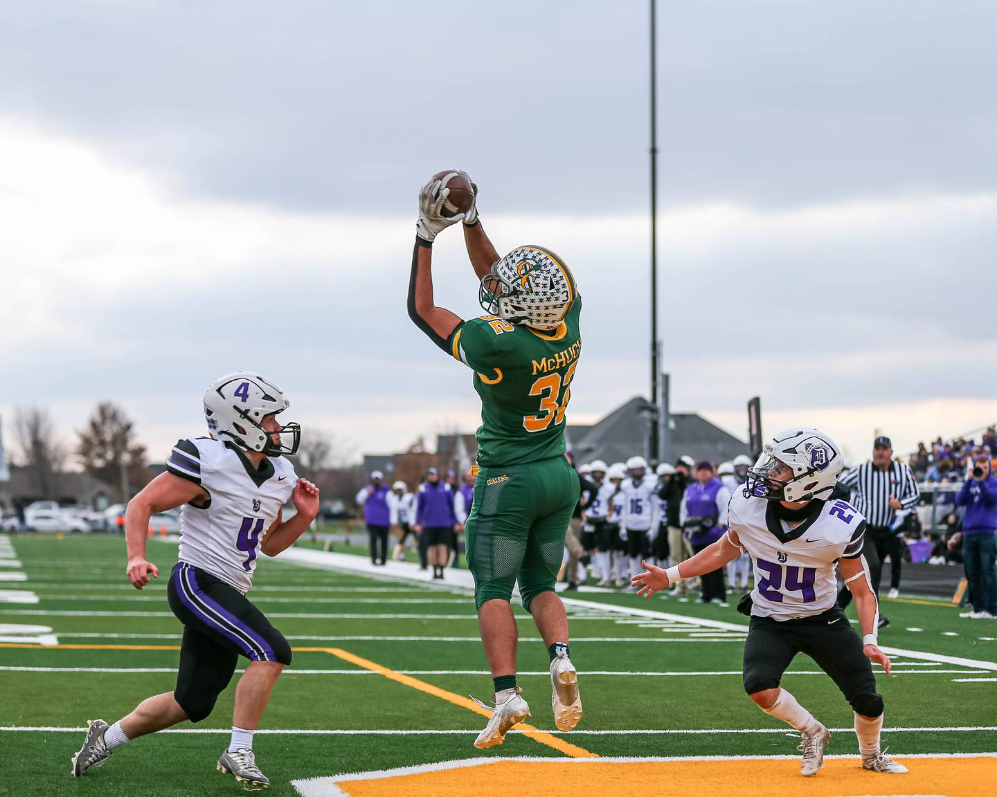 Coal City's Gabriel Mchugh (32) comes down with a touchdown reception between Dixon's Landon Knigge (4) and Carter Kibble (24) during Class 4A quarterfinal football game between Dixon at Coal City on Saturday, Nov 16, 2024  in Coal City.