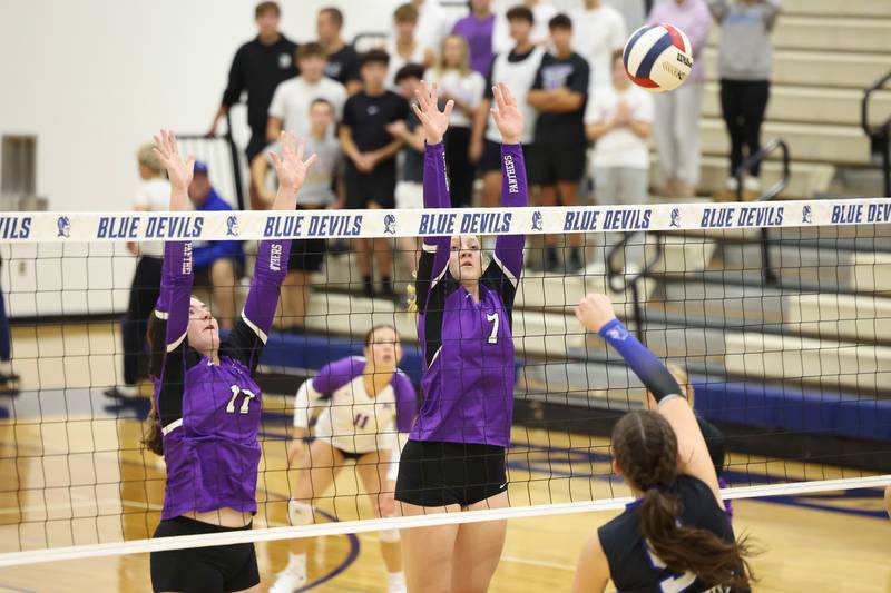 Manteno's Leah Milton, center, and Emily Horath jump to block a hit by Peotone's Cora Pagliarulo during the Panthers' victory in three sets, 19-25, 25-19, 25-21, over Peotone on Tuesday, Sept. 23, 2025.
