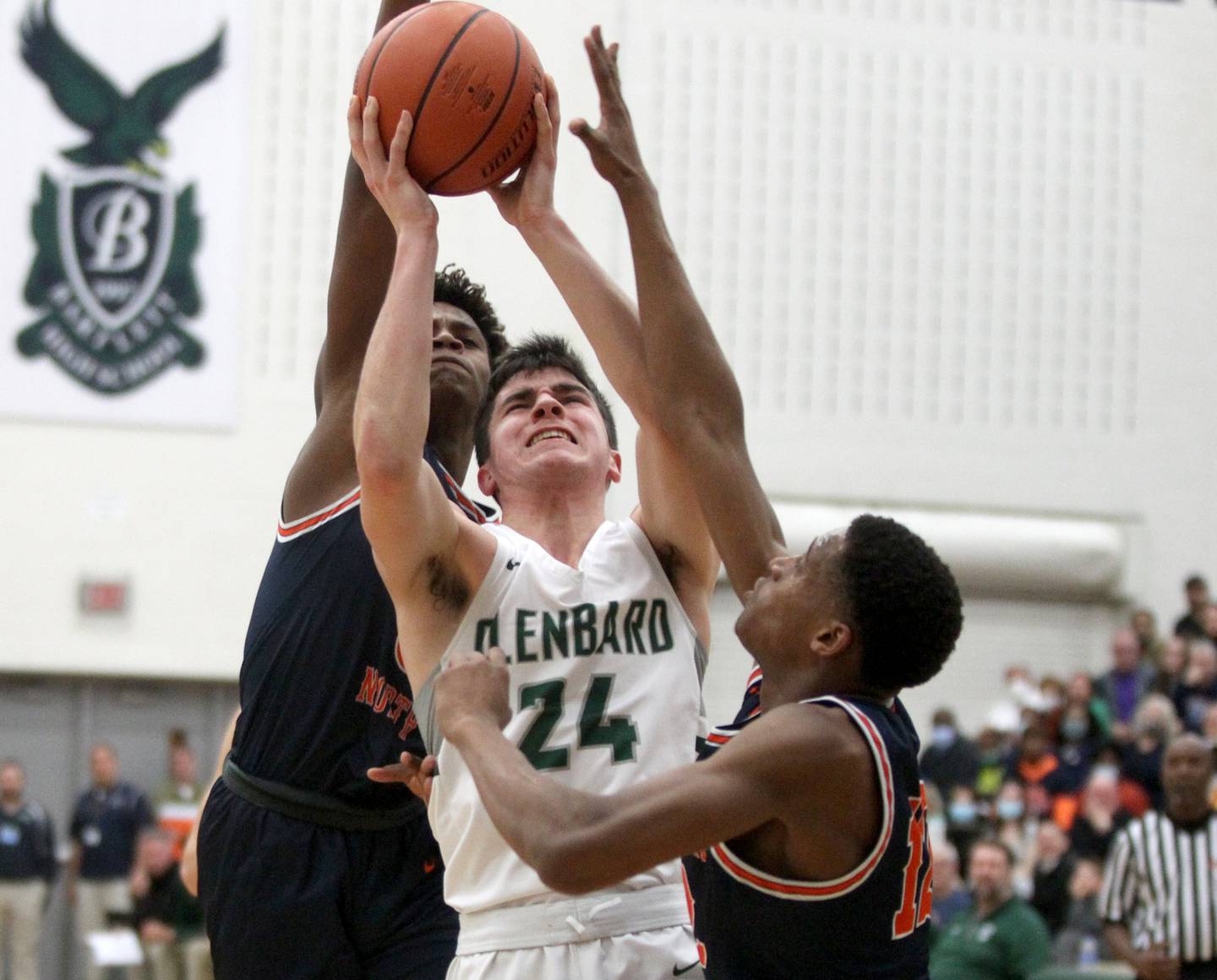 Glenbard West’s Paxton Warden (24) attempts a shot during a Class 4A Bartlett Sectional semifinal game against Naperville North on Tuesday, March 1, 2022.
