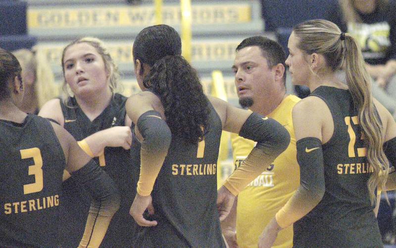 Sterling head Volleyball coach Dale Dykeman listen to his team during a time out. The action took place at the Sterling vs. Geneseo Volleyball match at Homer Musgrove fieldhouse, on Thursday, Sept. 5, 2024 .