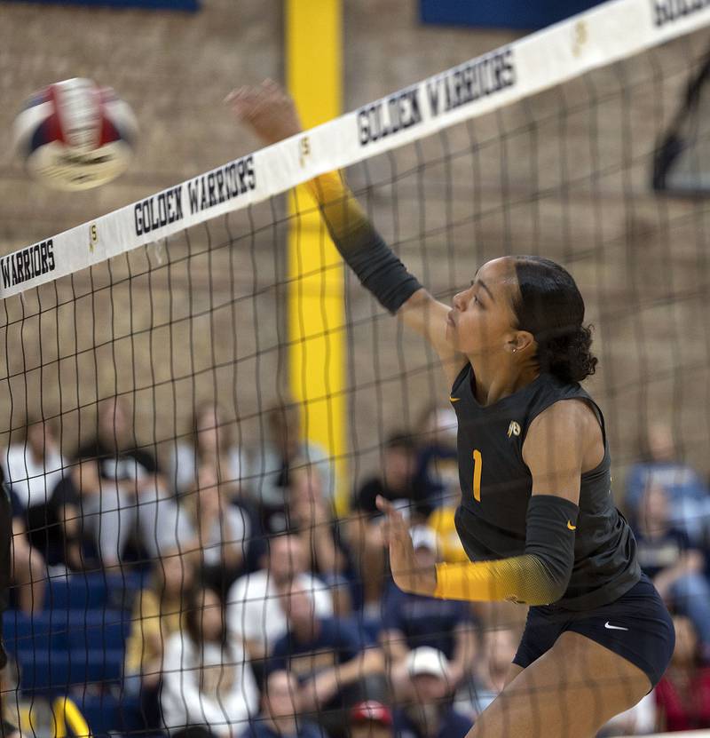 Sterling’s Nia Harris hammers a shot against Alleman Thursday, Sept. 25, 2025.