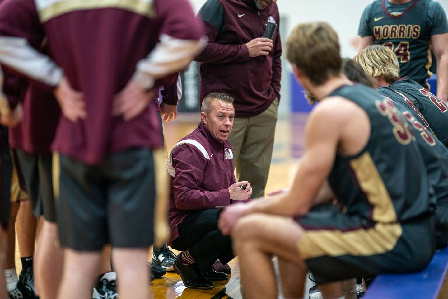 Morris head coach Joe Blumberg talks to his players during a break in play against Marmion during the 59th Annual Plano Christmas Classic basketball tournament at Plano High School on Tuesday, Dec 27, 2022.